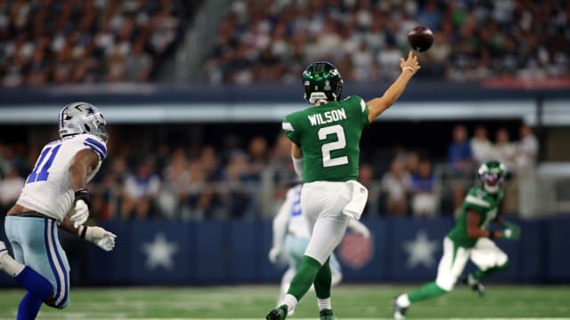 Jets' QB Zach Wilson (2) throws on the run vs. the Cowboys